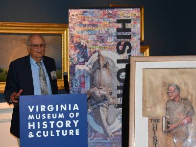 bill blake at the podium talking about the portrait